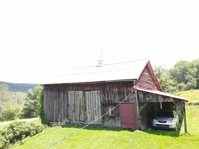 971 Indian Creek Rd, Eldred, PA 16731 - view of barn featuring a yard and a carport