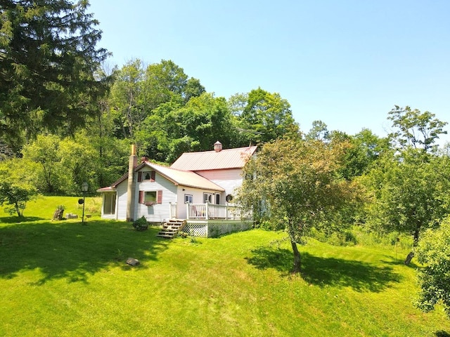 971 Indian Creek Rd, Eldred, PA 16731 - rear view of property featuring a chimney, a yard, and a deck