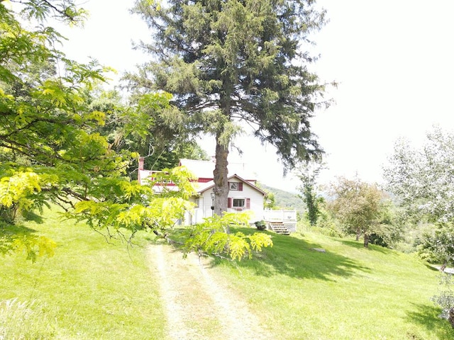 971 Indian Creek Rd, Eldred, PA 16731 - view of green lawn featuring dirt driveway and a wooden deck