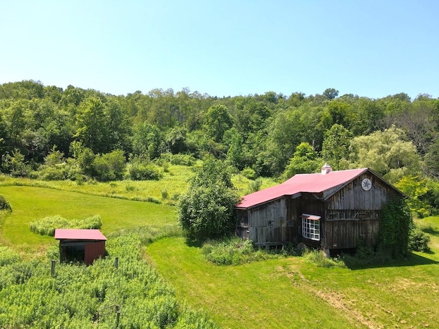 971 Indian Creek Rd, Eldred, PA 16731 - view of green lawn with an outdoor structure and a wooded view