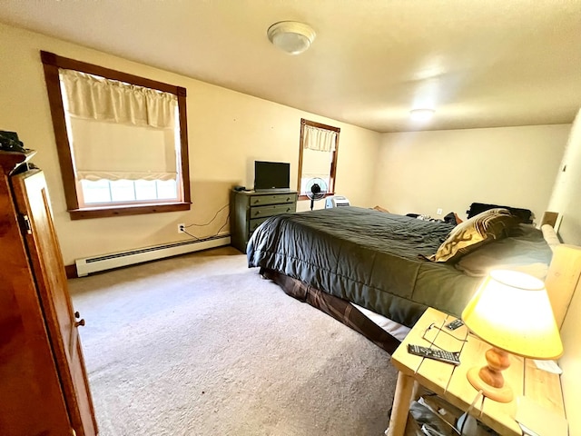 carpeted bedroom featuring a baseboard heating unit