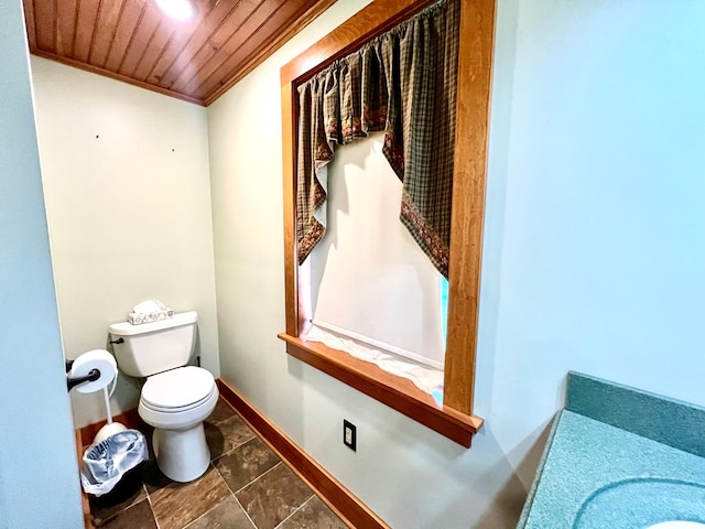 bathroom featuring ornamental molding, vanity, wood ceiling, and toilet