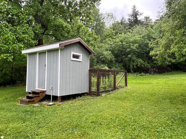 view of outdoor structure with a lawn