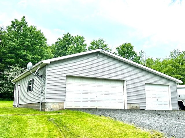 garage featuring a yard