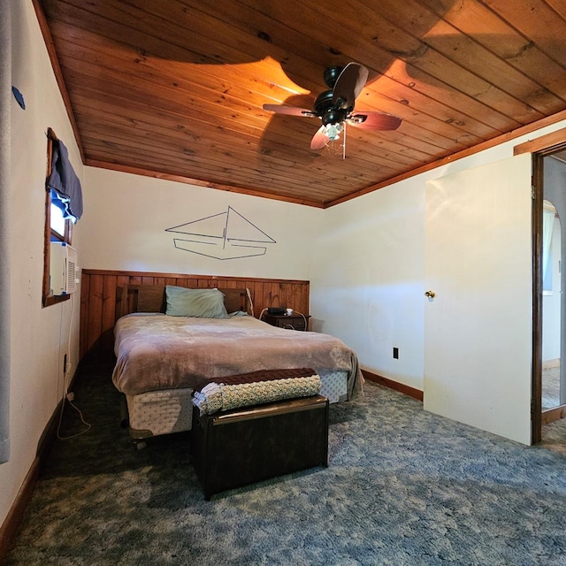 carpeted bedroom with ceiling fan and wood ceiling