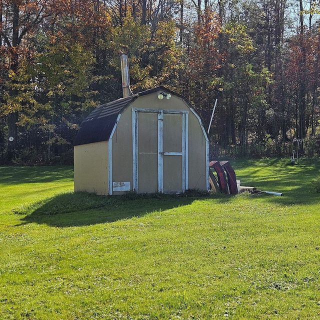 view of outdoor structure with a lawn