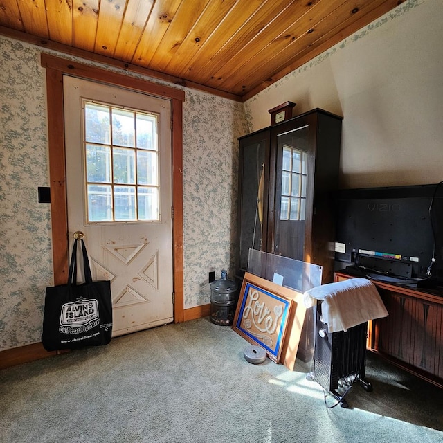 carpeted office space with wood ceiling