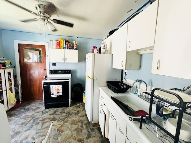 kitchen with white appliances, white cabinetry, ceiling fan, and sink