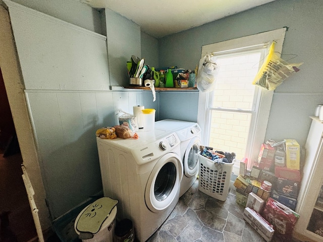 clothes washing area with washing machine and clothes dryer