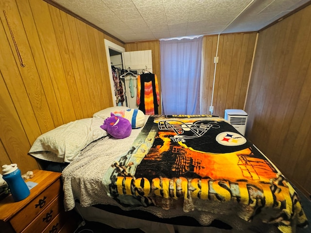 bedroom with wood walls