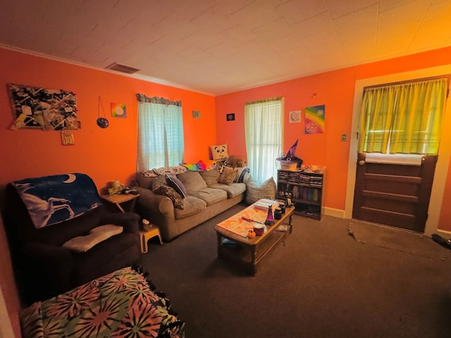 living room with carpet floors and ornamental molding