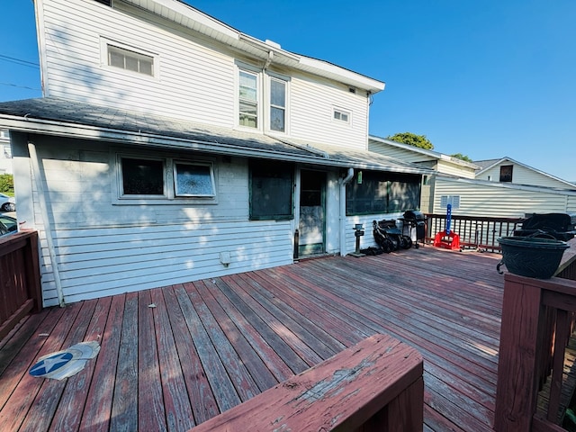 wooden deck featuring grilling area