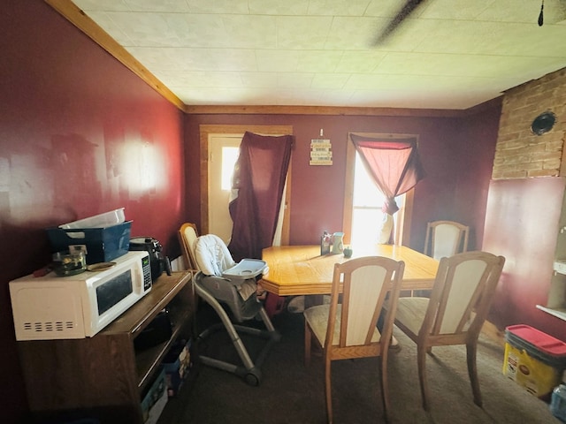 view of carpeted dining area