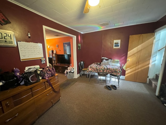 bedroom featuring carpet flooring, ceiling fan, and ornamental molding