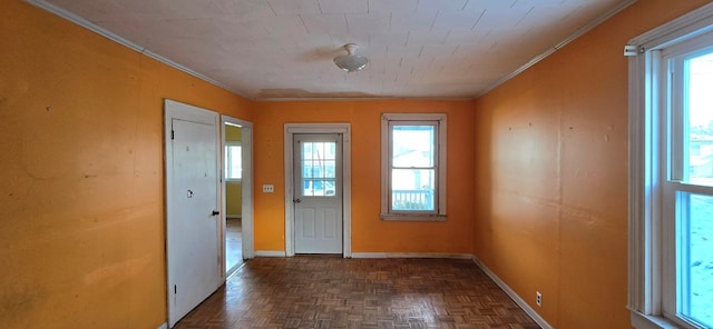 doorway to outside featuring dark parquet flooring and crown molding