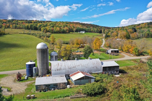 birds eye view of property with a rural view