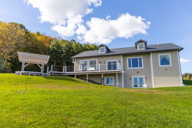 back of house with a lawn, a wooden deck, and french doors