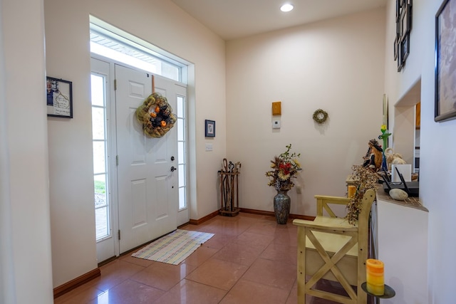 tiled foyer with a healthy amount of sunlight