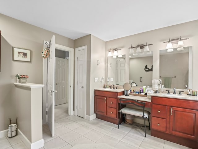 335 Sullivan Dr, Sayre, PA 18840 - bathroom with tile patterned floors, double vanity, and baseboards