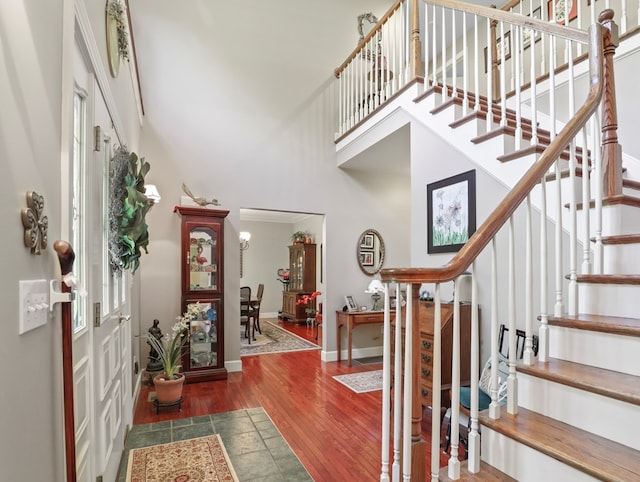335 Sullivan Dr, Sayre, PA 18840 - entrance foyer featuring a towering ceiling, stairway, wood finished floors, and baseboards