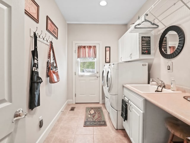 335 Sullivan Dr, Sayre, PA 18840 - clothes washing area with cabinet space, washer and clothes dryer, light tile patterned flooring, recessed lighting, and baseboards