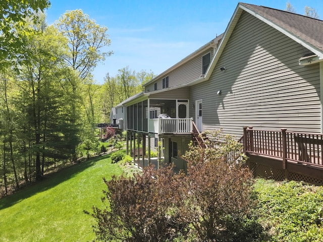 335 Sullivan Dr, Sayre, PA 18840 - back of property with a sunroom, a deck, and a yard