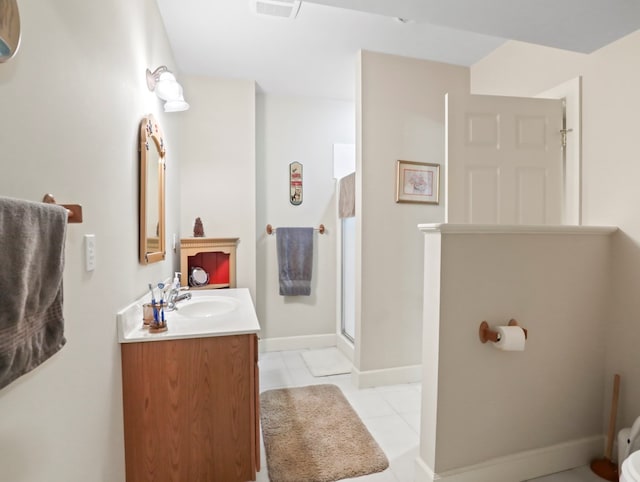 335 Sullivan Dr, Sayre, PA 18840 - bathroom with a walk in shower, vanity, tile patterned flooring, and baseboards