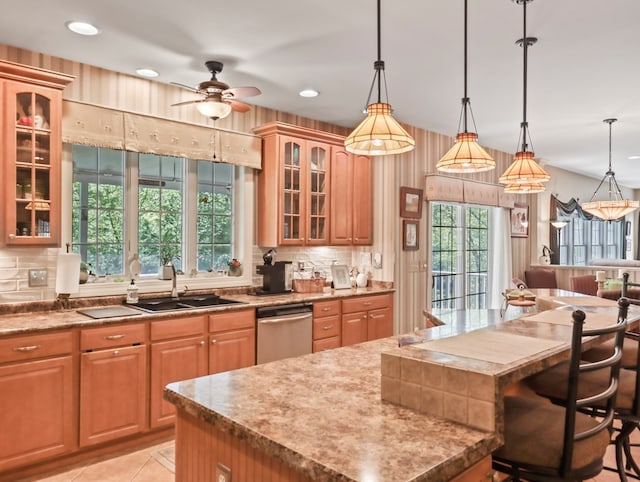 335 Sullivan Dr, Sayre, PA 18840 - kitchen with a sink, dishwasher, backsplash, a kitchen island, and recessed lighting