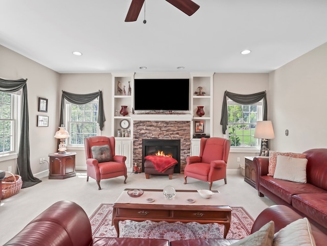 335 Sullivan Dr, Sayre, PA 18840 - carpeted living room with ceiling fan, a stone fireplace, recessed lighting, and baseboards