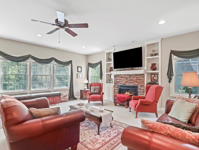 335 Sullivan Dr, Sayre, PA 18840 - living room featuring ceiling fan, recessed lighting, a stone fireplace, carpet, and built in shelves