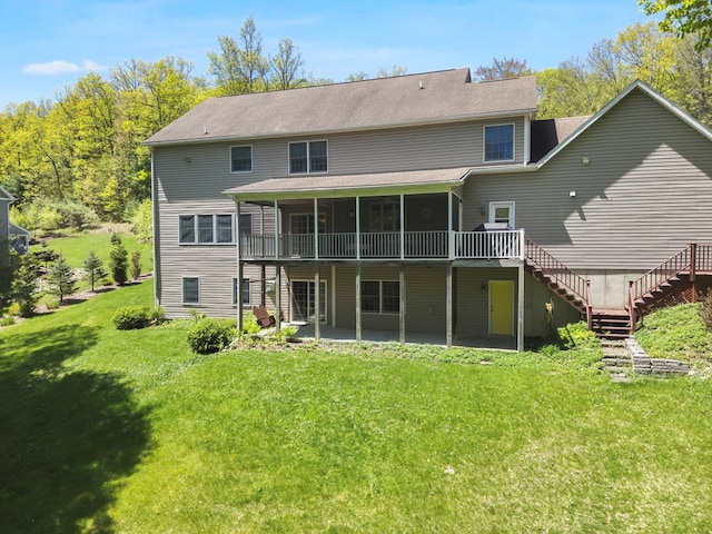 335 Sullivan Dr, Sayre, PA 18840 - back of house with stairs, a patio, a sunroom, a lawn, and a wooden deck