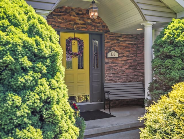 335 Sullivan Dr, Sayre, PA 18840 - view of exterior entry with a porch and stone siding