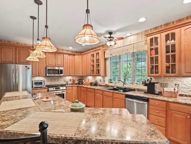 335 Sullivan Dr, Sayre, PA 18840 - kitchen featuring stainless steel appliances, a sink, a large island with sink, backsplash, and ceiling fan
