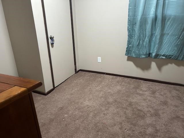 unfurnished bedroom featuring light colored carpet