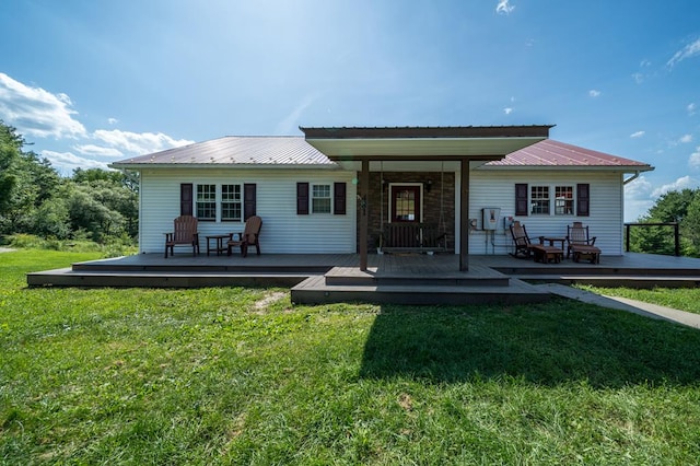 481 Case Rd, Sayre, PA 18840 - back of house with a yard, a metal roof, and a wooden deck
