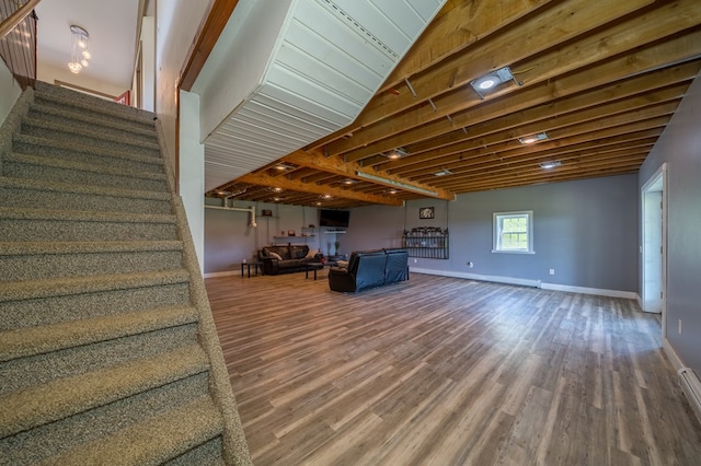 481 Case Rd, Sayre, PA 18840 - living area featuring stairway, wood finished floors, and baseboard heating