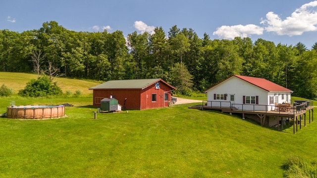 481 Case Rd, Sayre, PA 18840 - view of green lawn featuring a deck, an outdoor pool, and an outdoor structure