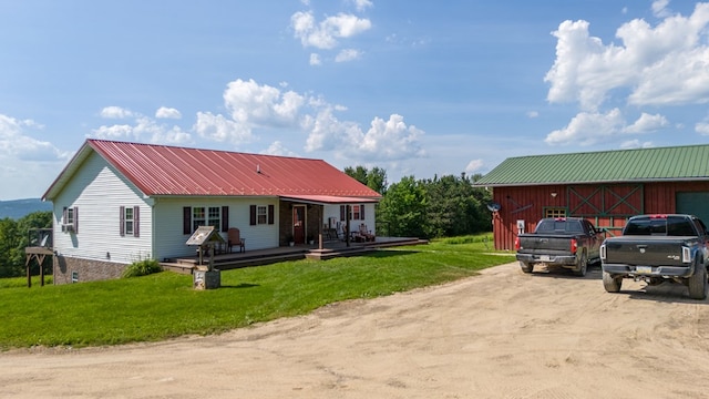 481 Case Rd, Sayre, PA 18840 - view of front of home with a front lawn, dirt driveway, a metal roof, and a deck