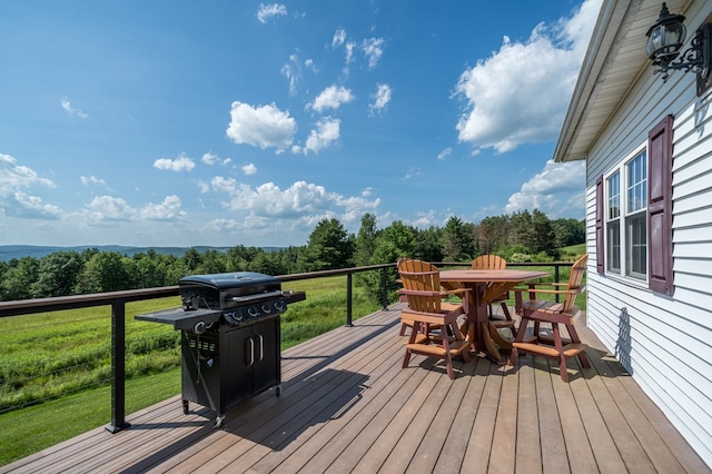 481 Case Rd, Sayre, PA 18840 - deck with outdoor dining space, a yard, grilling area, and view of wooded area