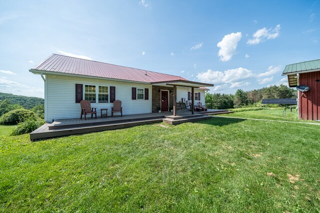 481 Case Rd, Sayre, PA 18840 - back of house with a yard, a metal roof, and a wooden deck