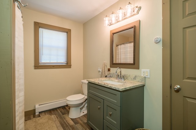 481 Case Rd, Sayre, PA 18840 - full bathroom with a baseboard radiator, wood finished floors, and vanity