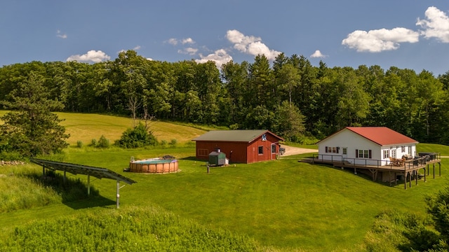 481 Case Rd, Sayre, PA 18840 - view of grassy yard featuring a deck, an outdoor pool, and a forest view