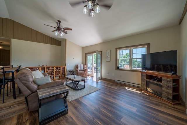 481 Case Rd, Sayre, PA 18840 - living room with a ceiling fan, wood finished floors, vaulted ceiling, baseboard heating, and a stone fireplace
