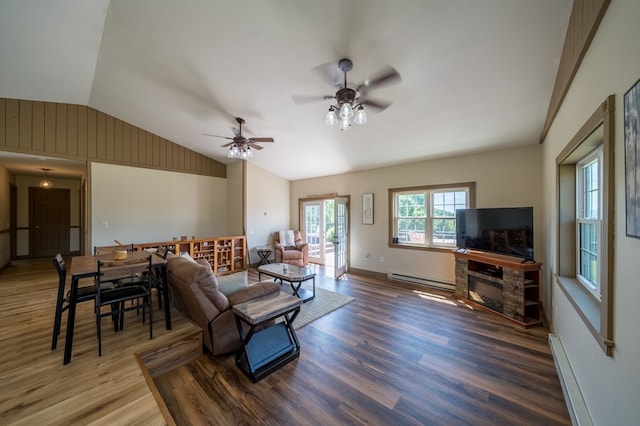 481 Case Rd, Sayre, PA 18840 - living area featuring a baseboard heating unit, vaulted ceiling, wood finished floors, a ceiling fan, and baseboard heating