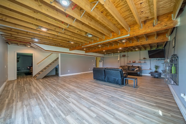 481 Case Rd, Sayre, PA 18840 - below grade area featuring stairs and wood finished floors