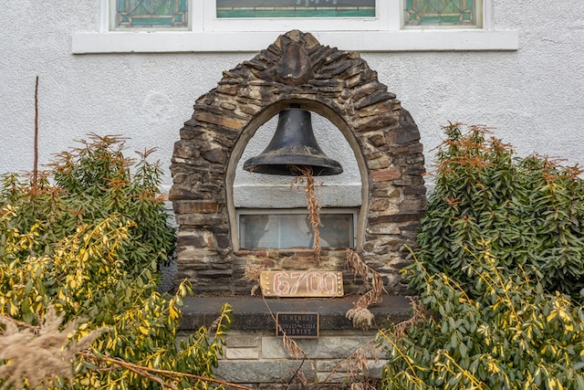 exterior details with stone siding and stucco siding