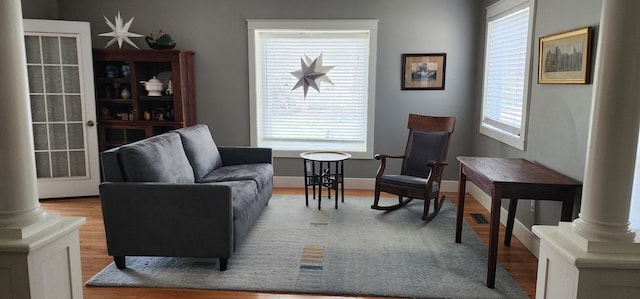 30 S Academy St, Mansfield, PA 16933 - living area featuring baseboards, decorative columns, and wood finished floors