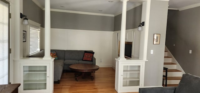30 S Academy St, Mansfield, PA 16933 - sitting room featuring stairway, ornamental molding, decorative columns, and wood finished floors