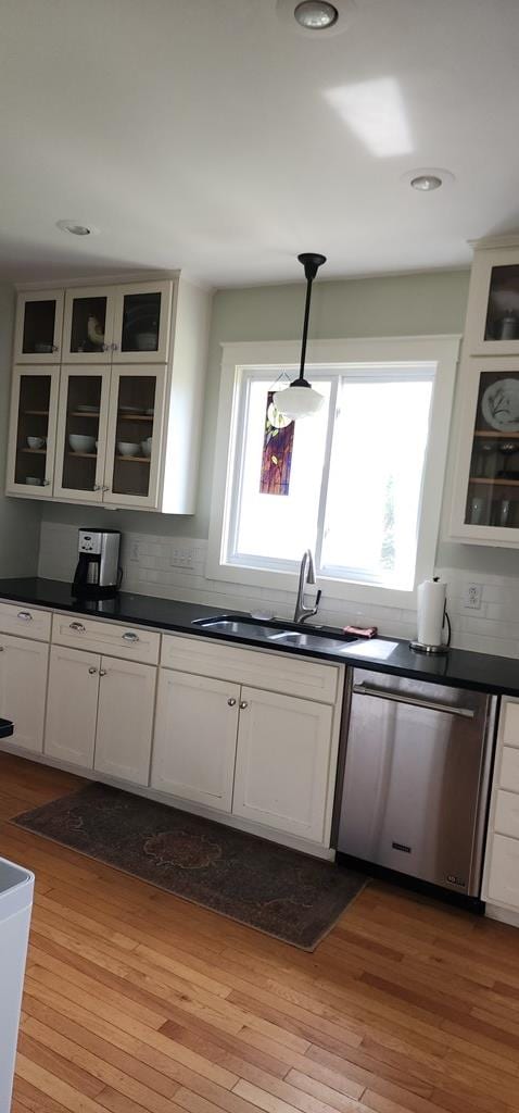 30 S Academy St, Mansfield, PA 16933 - kitchen with a sink, dark countertops, stainless steel dishwasher, and a wealth of natural light