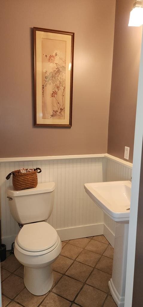 30 S Academy St, Mansfield, PA 16933 - bathroom featuring a wainscoted wall, tile patterned flooring, and toilet